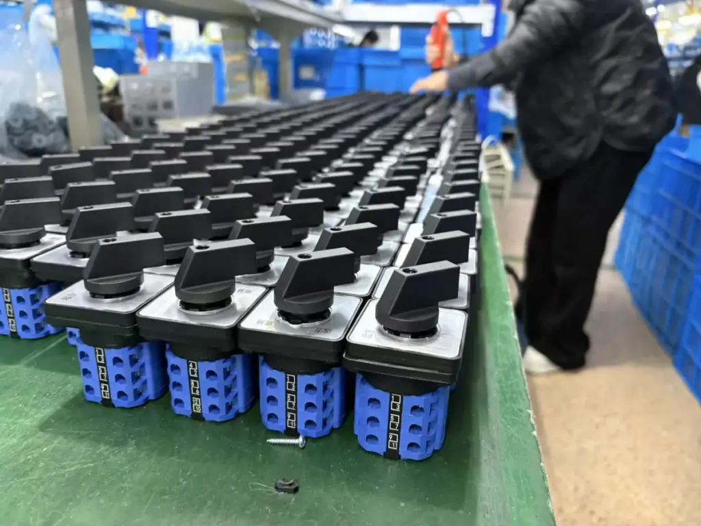 Completed rotary cam switches arranged for production-stage inspection at VIOX